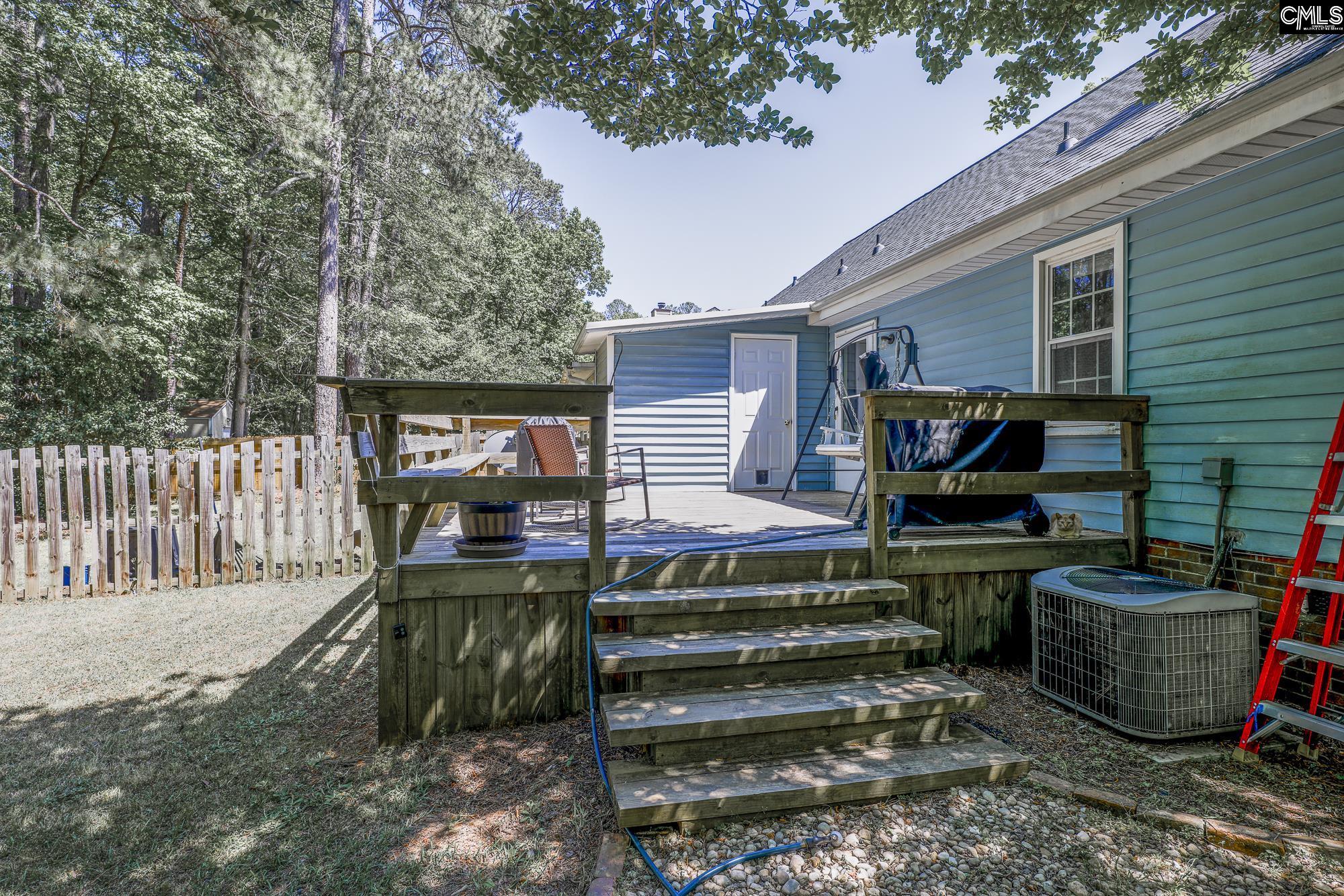 152 Thames Valley Court Irmo, SC 29063 - Photo 3 of 32 a view of a chairs and tables in the back yard of the house