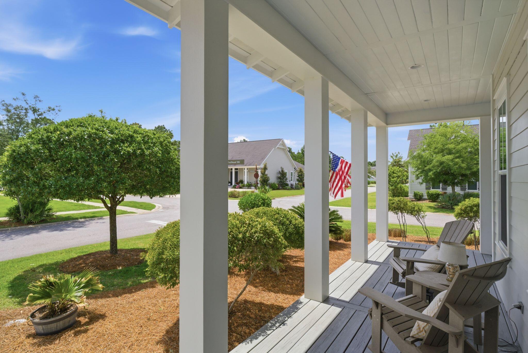 133 Sandchase Circle, Unit LOT 15 Inlet Beach, FL 32461 - Photo 4 of 47 a view of a porch with furniture and garden