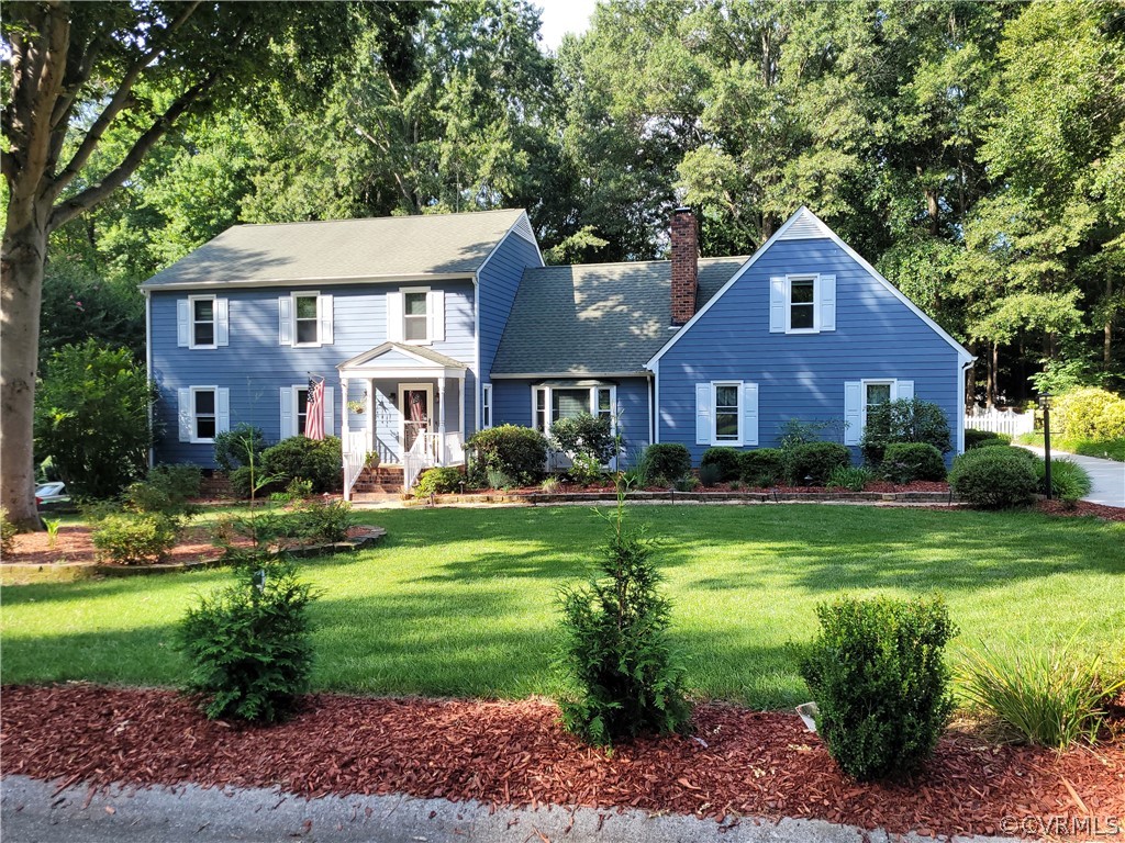 13803 Sunrise Bluff Road Midlothian, VA 23112 - Photo 1 of 42 a front view of a house with a yard