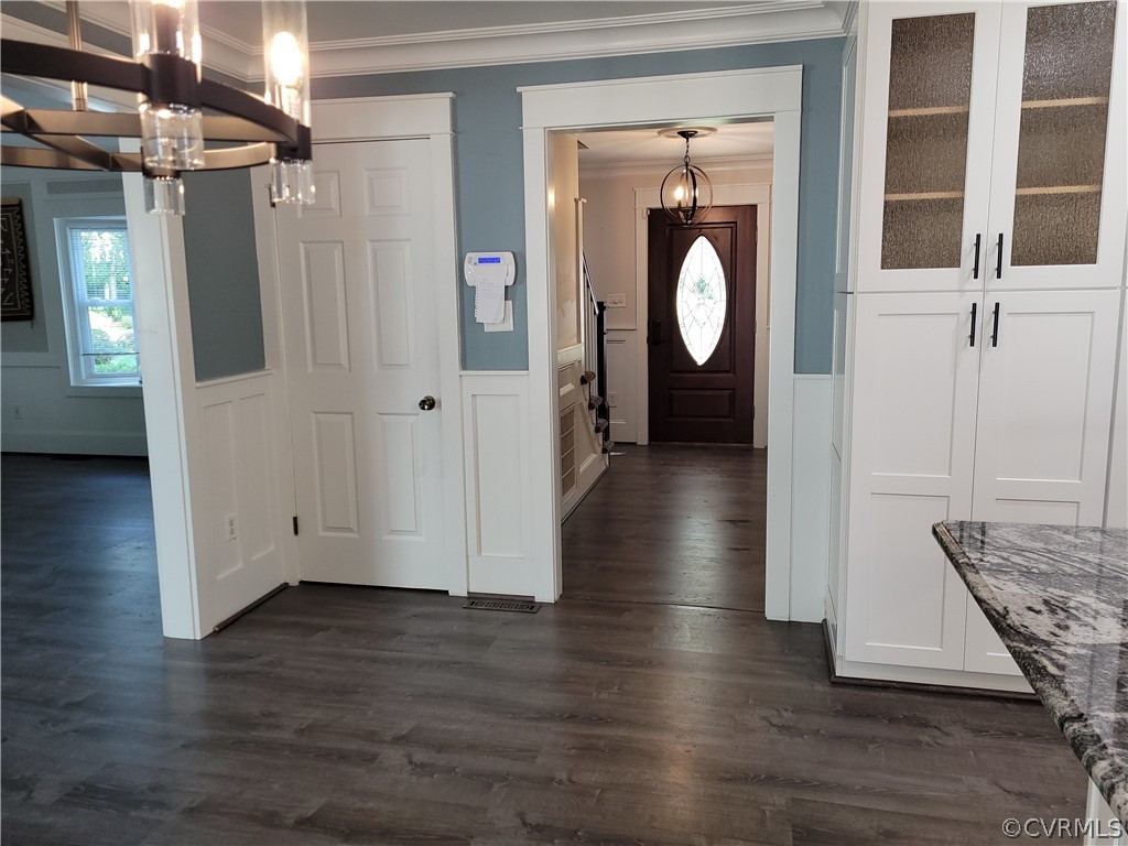 13803 Sunrise Bluff Road Midlothian, VA 23112 - Photo 11 of 42 a view of a hallway with wooden floor windows and entryway