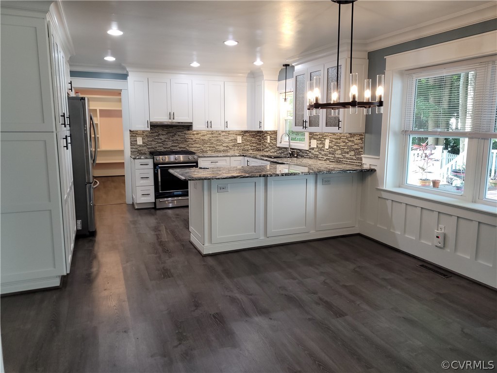 13803 Sunrise Bluff Road Midlothian, VA 23112 - Photo 13 of 42 a kitchen with stainless steel appliances granite countertop a sink a stove a refrigerator and a wooden floor