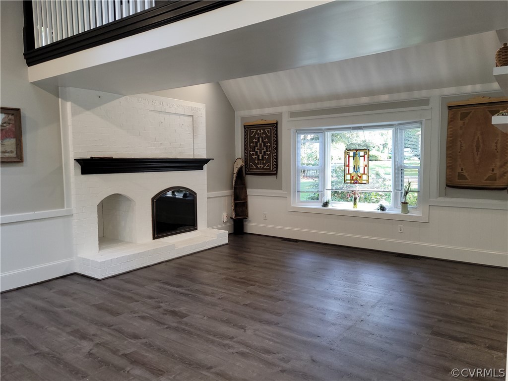 13803 Sunrise Bluff Road Midlothian, VA 23112 - Photo 14 of 42 an empty room with wooden floor a fireplace and windows