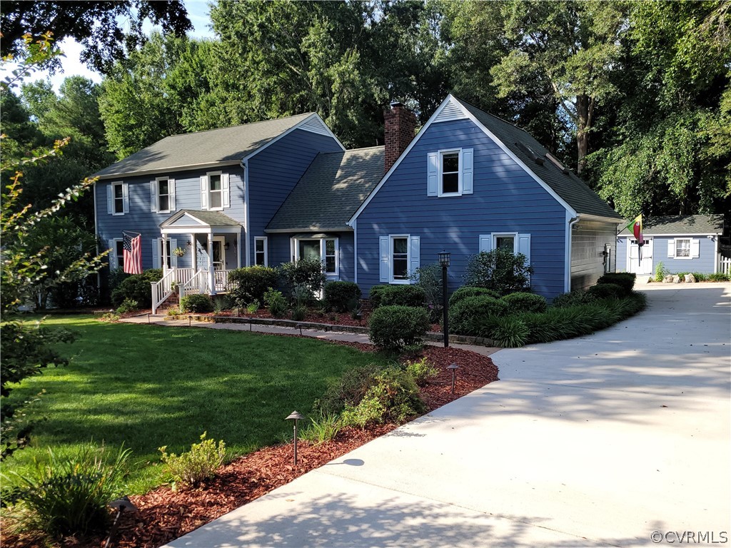 13803 Sunrise Bluff Road Midlothian, VA 23112 - Photo 2 of 42 a front view of a house with a yard