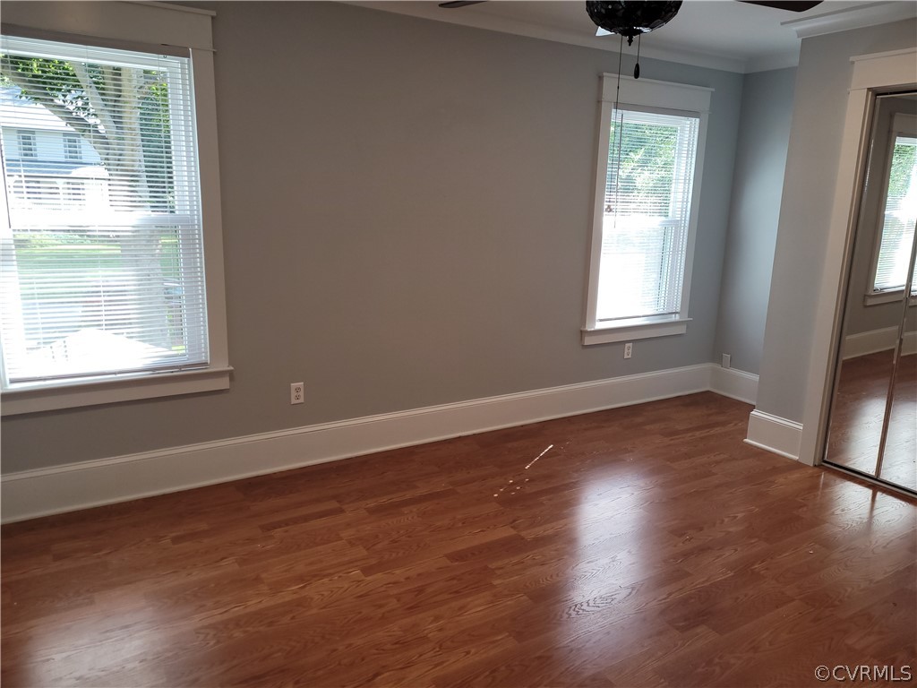 13803 Sunrise Bluff Road Midlothian, VA 23112 - Photo 25 of 42 an empty room with wooden floor and windows