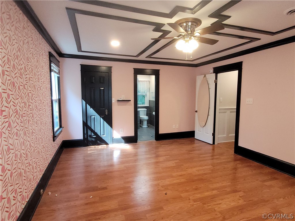 13803 Sunrise Bluff Road Midlothian, VA 23112 - Photo 29 of 42 an empty room with wooden floor and windows