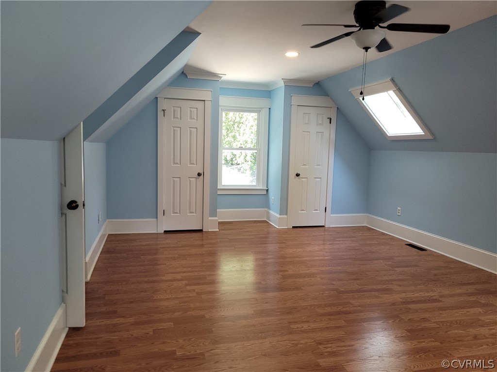 13803 Sunrise Bluff Road Midlothian, VA 23112 - Photo 32 of 42 an empty room with wooden floor cabinet and windows