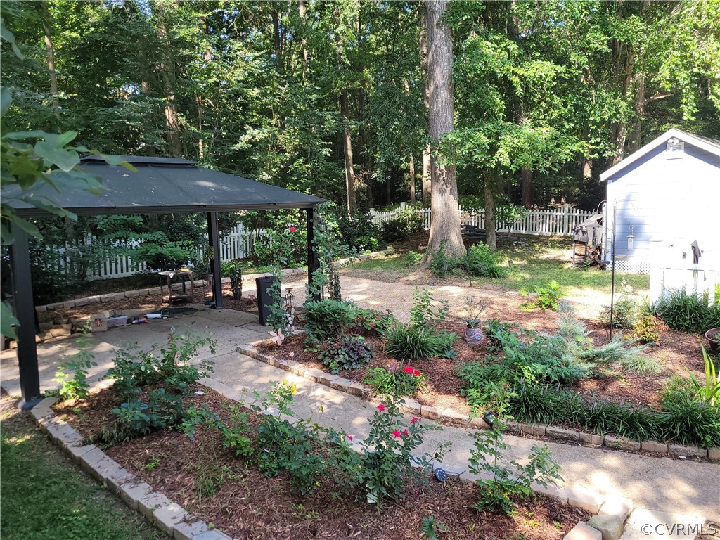 13803 Sunrise Bluff Road Midlothian, VA 23112 - Photo 38 of 42 a backyard of a house with yard barbeque oven and outdoor seating