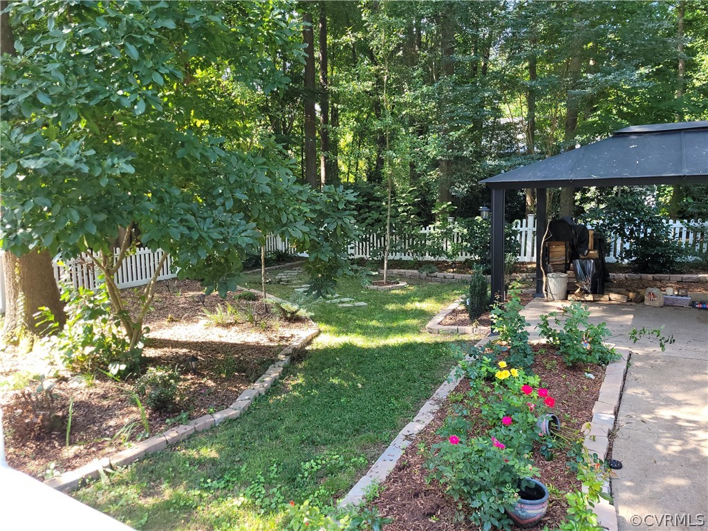 13803 Sunrise Bluff Road Midlothian, VA 23112 - Photo 39 of 42 a view of a garden with flowers