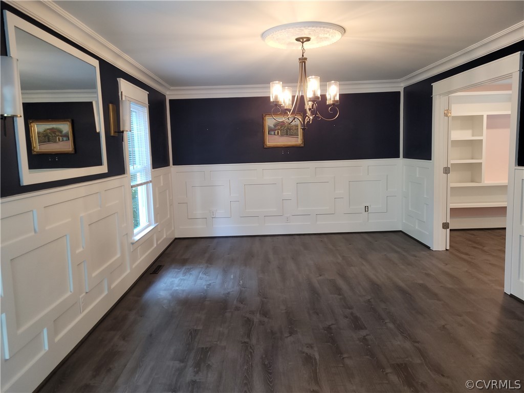 13803 Sunrise Bluff Road Midlothian, VA 23112 - Photo 5 of 42 a view of an empty room with wooden floor and kitchen view