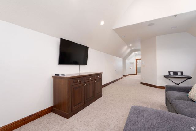 687 South 2080th Street East Springville, UT 84663 - Photo 56 of 149 Recessed lighting illuminates this carpeted room featuring a built-in wood-finish media console and coordinating baseboards