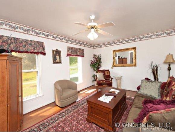 378 Yates Cove Road Waynesville, NC 28785 - Photo 3 of 17 a living room with furniture and a window