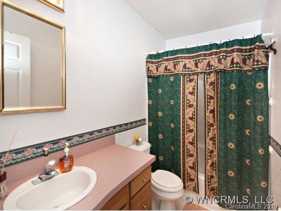 378 Yates Cove Road Waynesville, NC 28785 - Photo 7 of 17 a bathroom with a sink toilet and shower