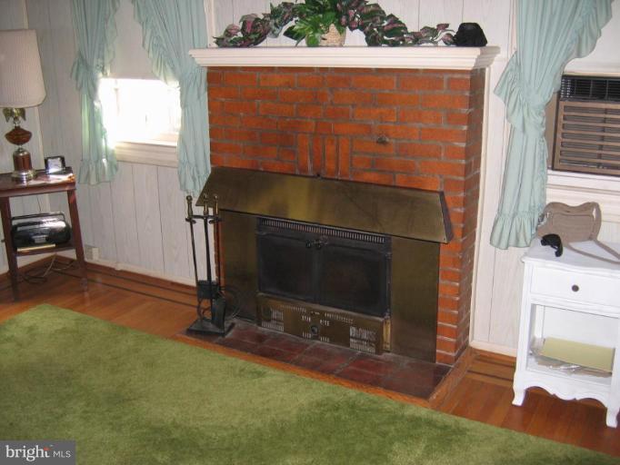 6307 Beechwood Road Baltimore, MD 21239 - Photo 9 of 14 LR fireplace