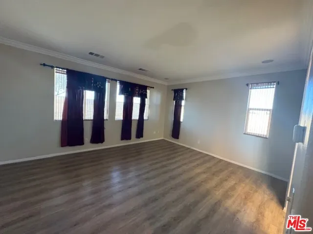 a bathroom with a double vanity sink and mirror with bathtub