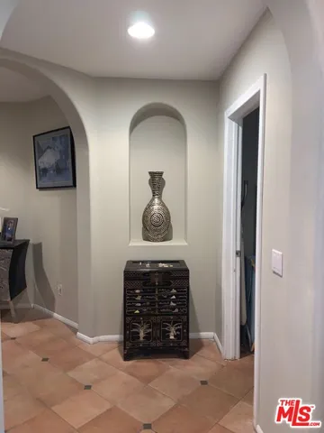 a large kitchen with stainless steel appliances granite countertop a large counter top and a stove top oven