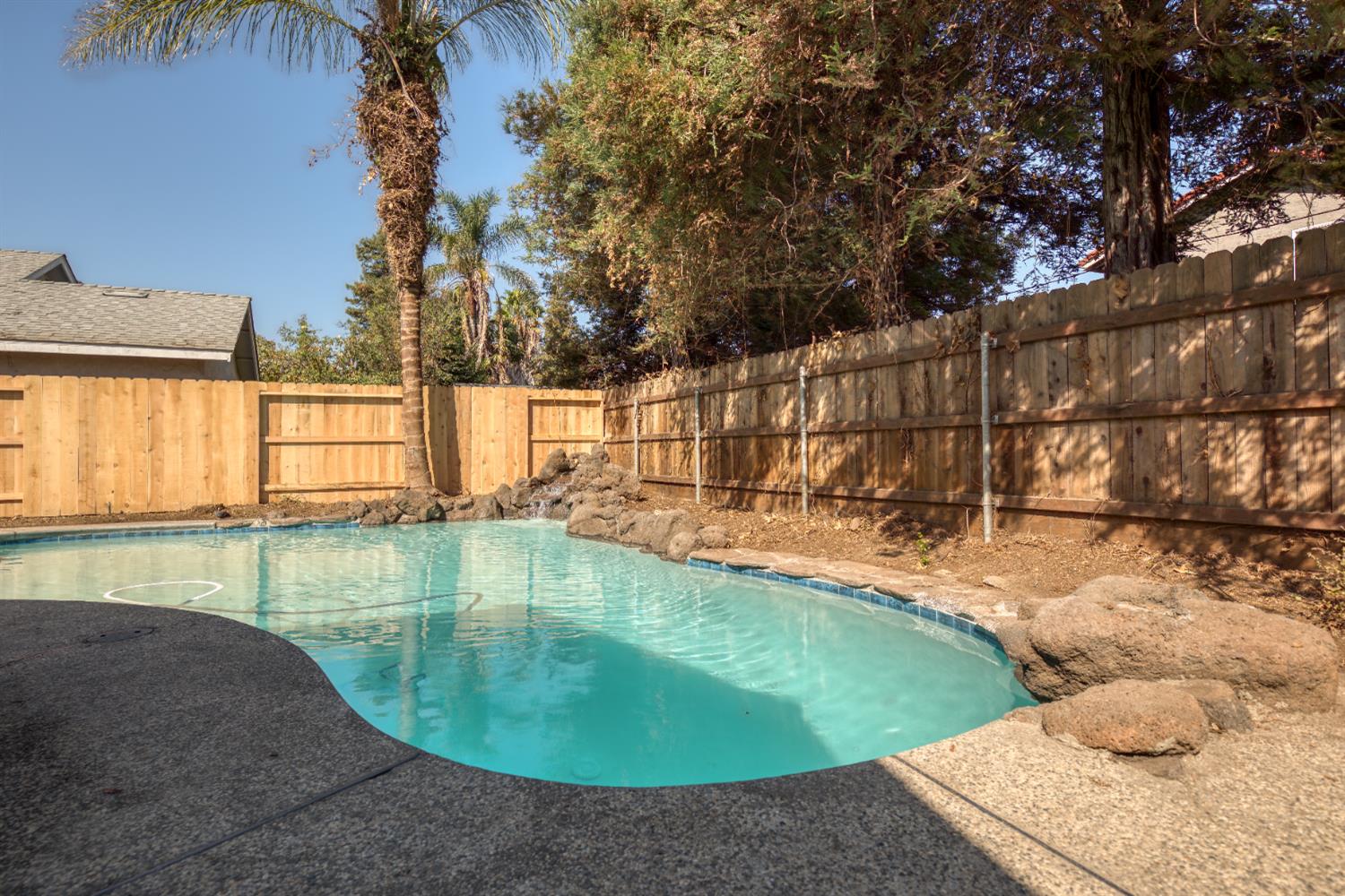 1621 Davis Street Ripon, CA 95366 - Photo 41 of 43 view of pool featuring a fenced backyard