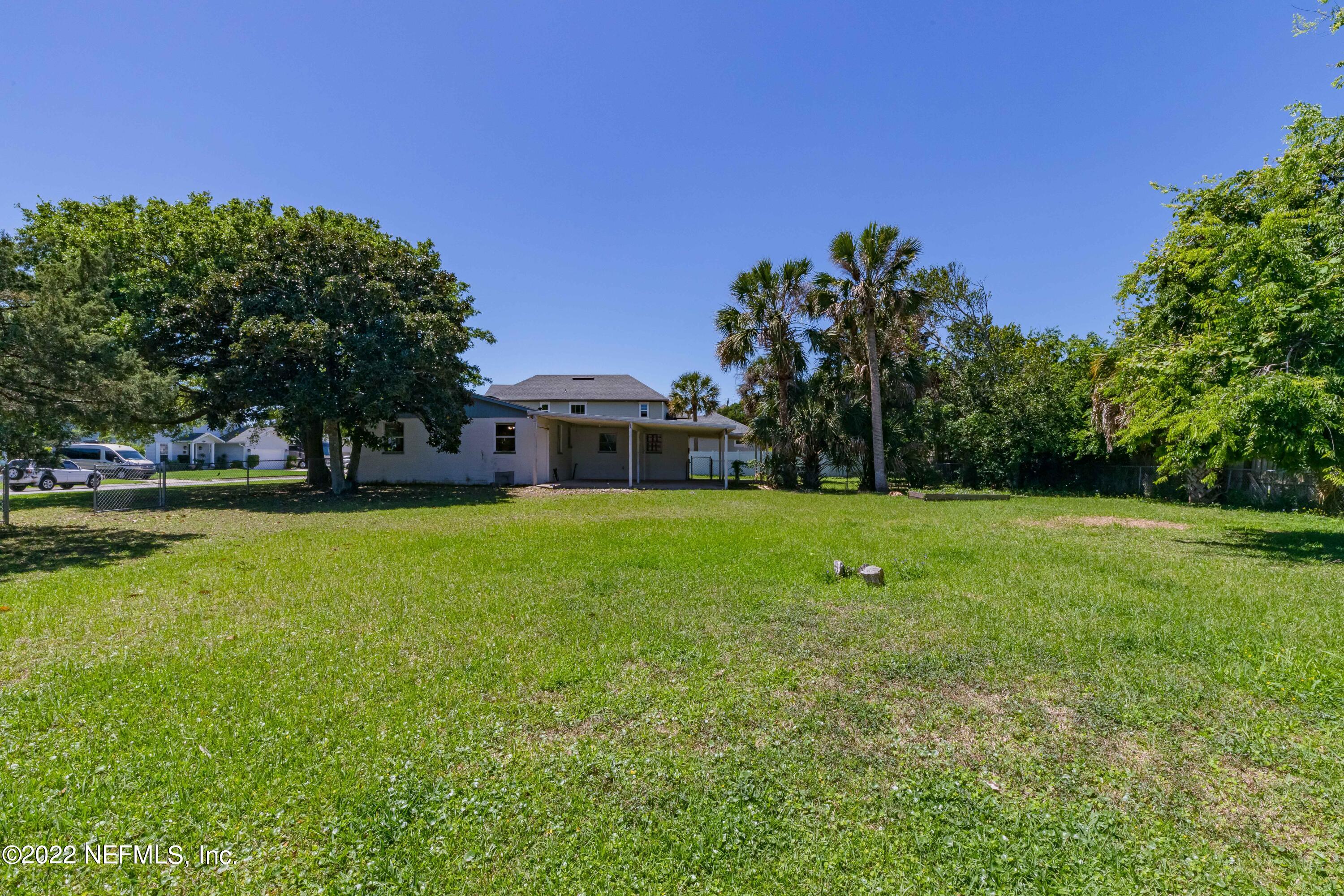 306 Ribault Street St. Augustine, FL 32080 - Photo 12 of 31 a front view of a house with a yard