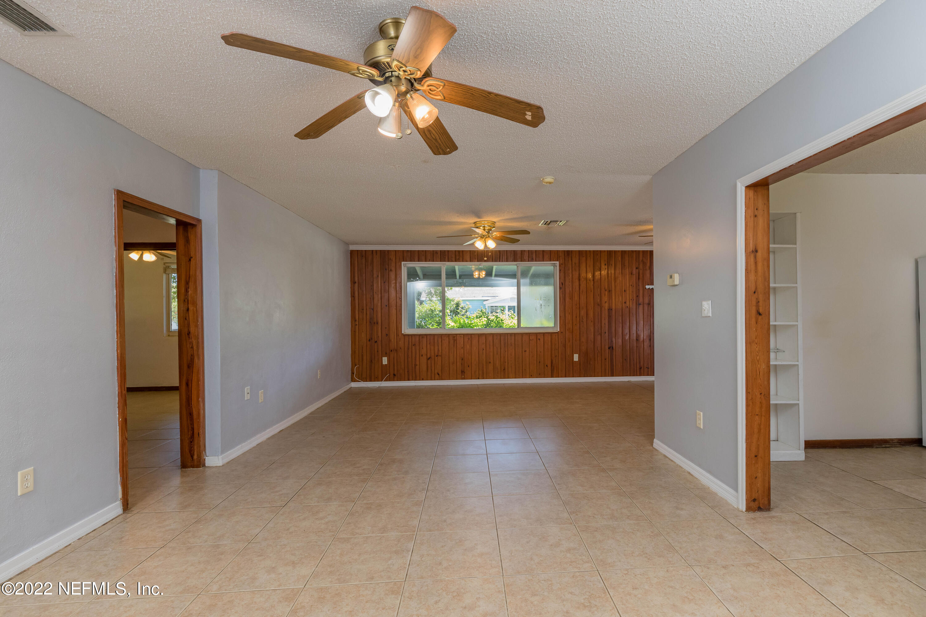 306 Ribault Street St. Augustine, FL 32080 - Photo 13 of 31 an empty room with windows and fan