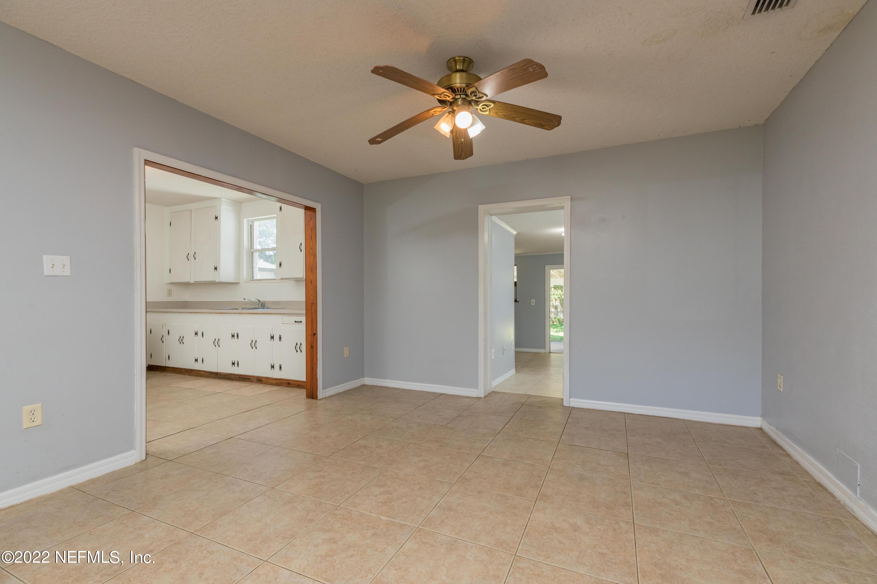 306 Ribault Street St. Augustine, FL 32080 - Photo 14 of 31 a view of an empty room with a chandelier fan