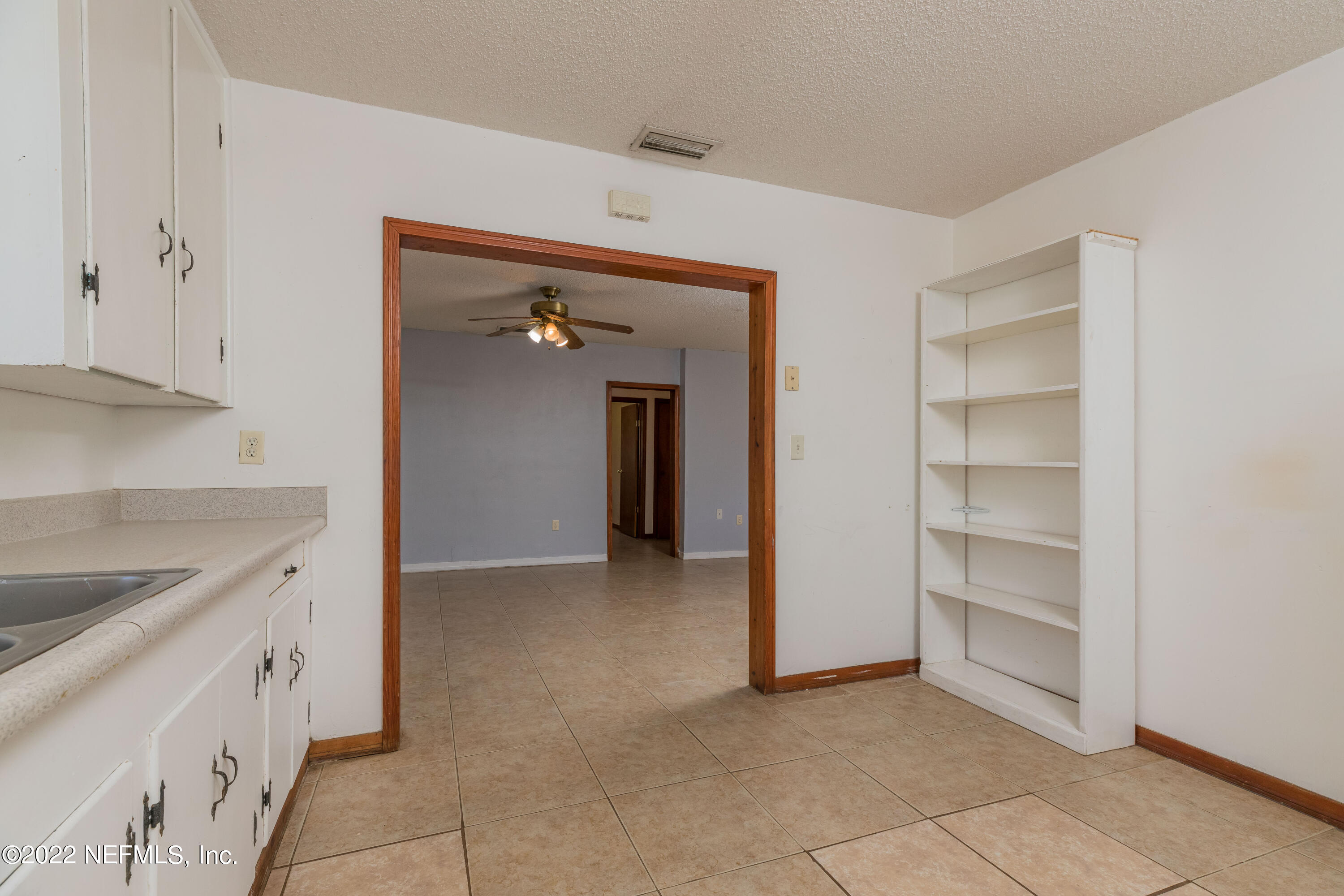 306 Ribault Street St. Augustine, FL 32080 - Photo 17 of 31 a view of a kitchen cabinets and a utility room