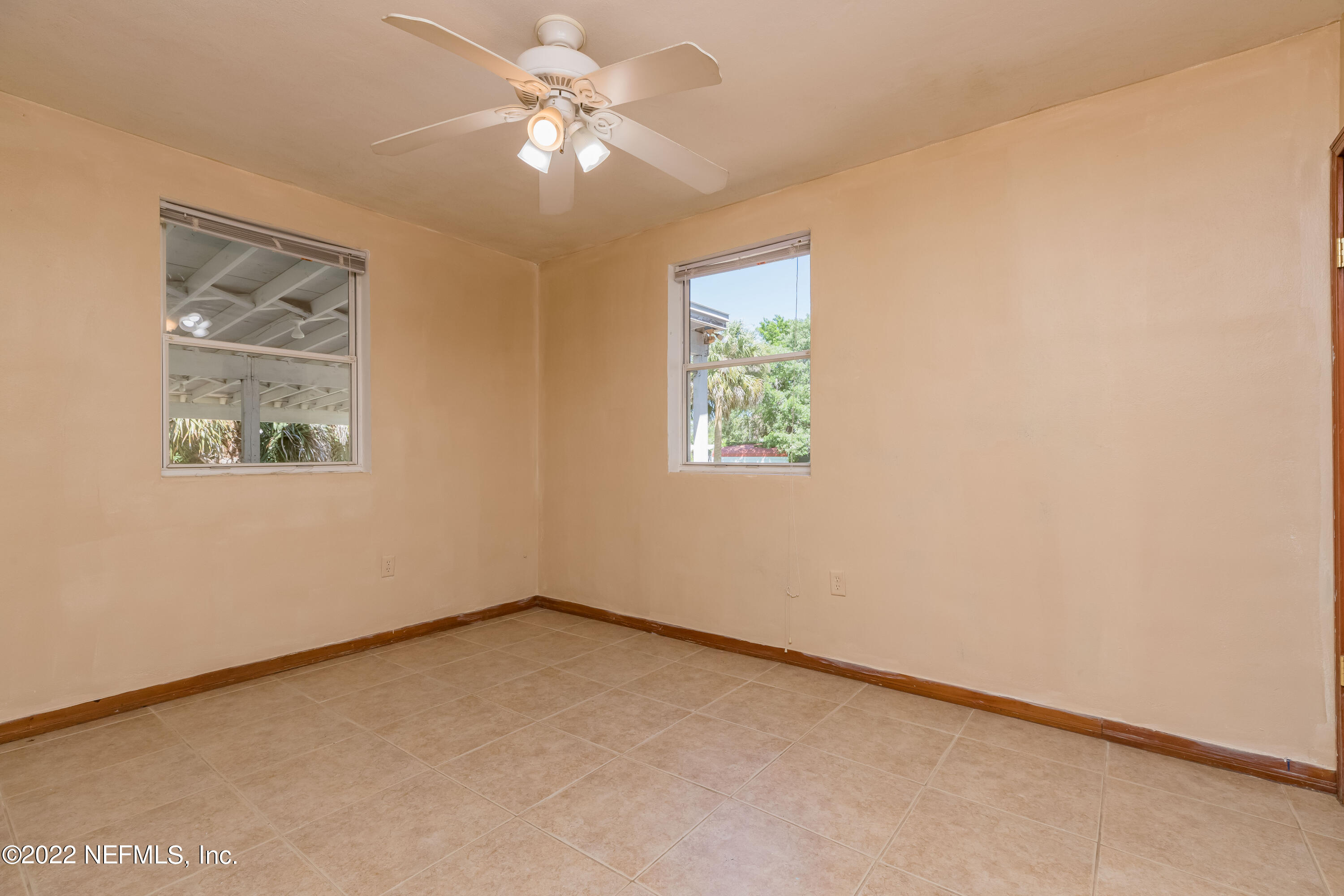 306 Ribault Street St. Augustine, FL 32080 - Photo 21 of 31 an empty room with windows and fan