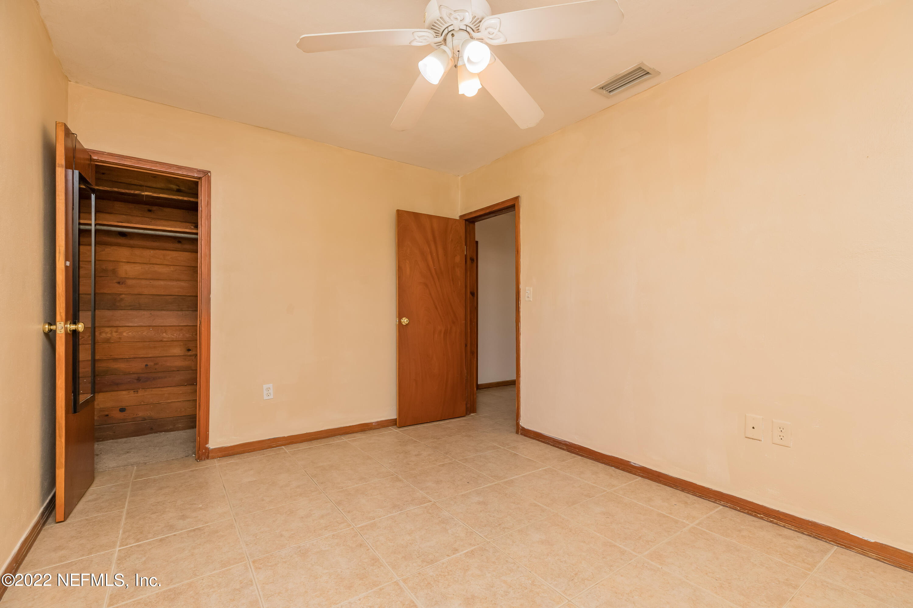 306 Ribault Street St. Augustine, FL 32080 - Photo 22 of 31 a view of an empty room with a ceiling fan