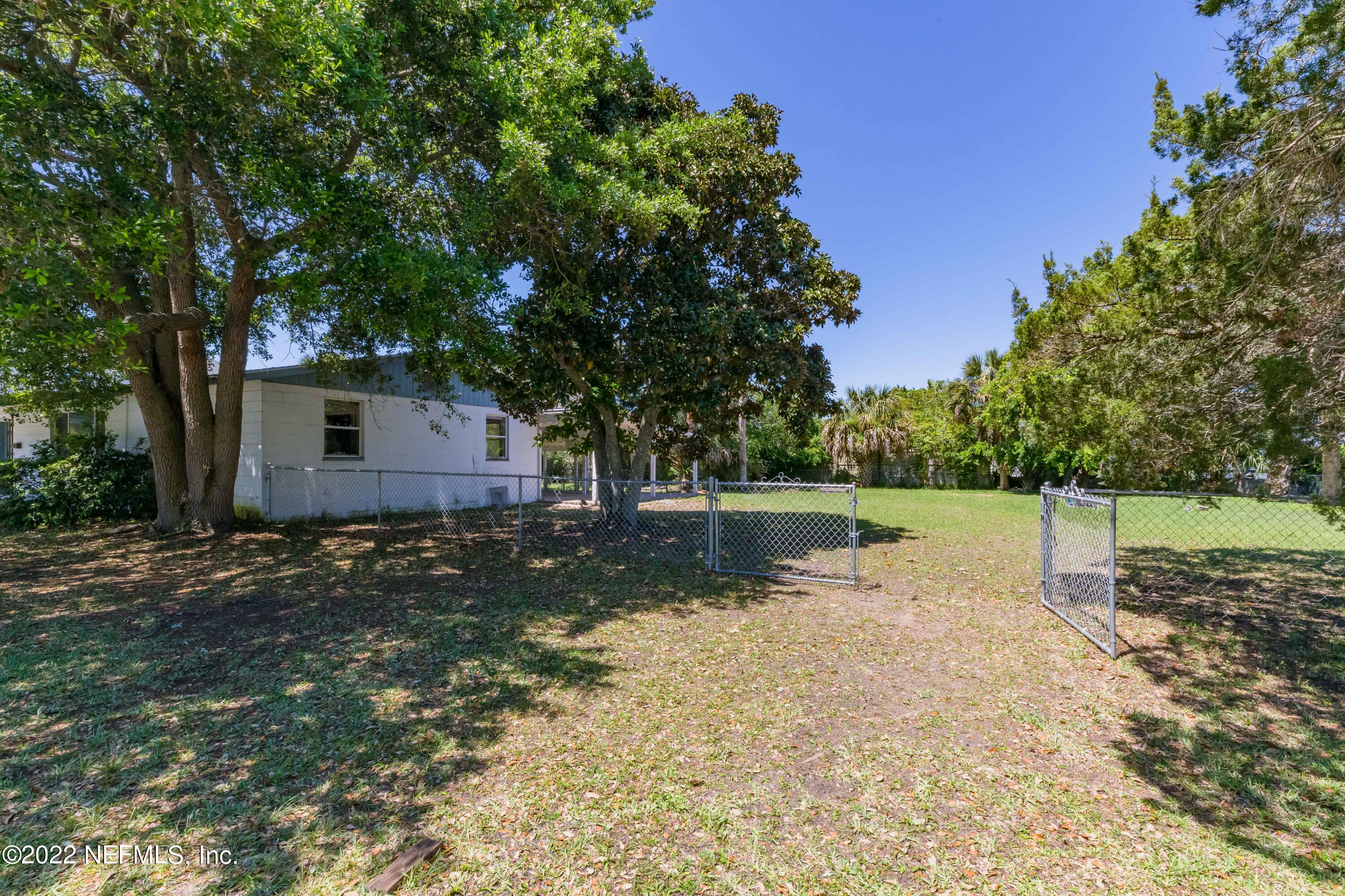 306 Ribault Street St. Augustine, FL 32080 - Photo 7 of 31 a view of a yard with plants and trees