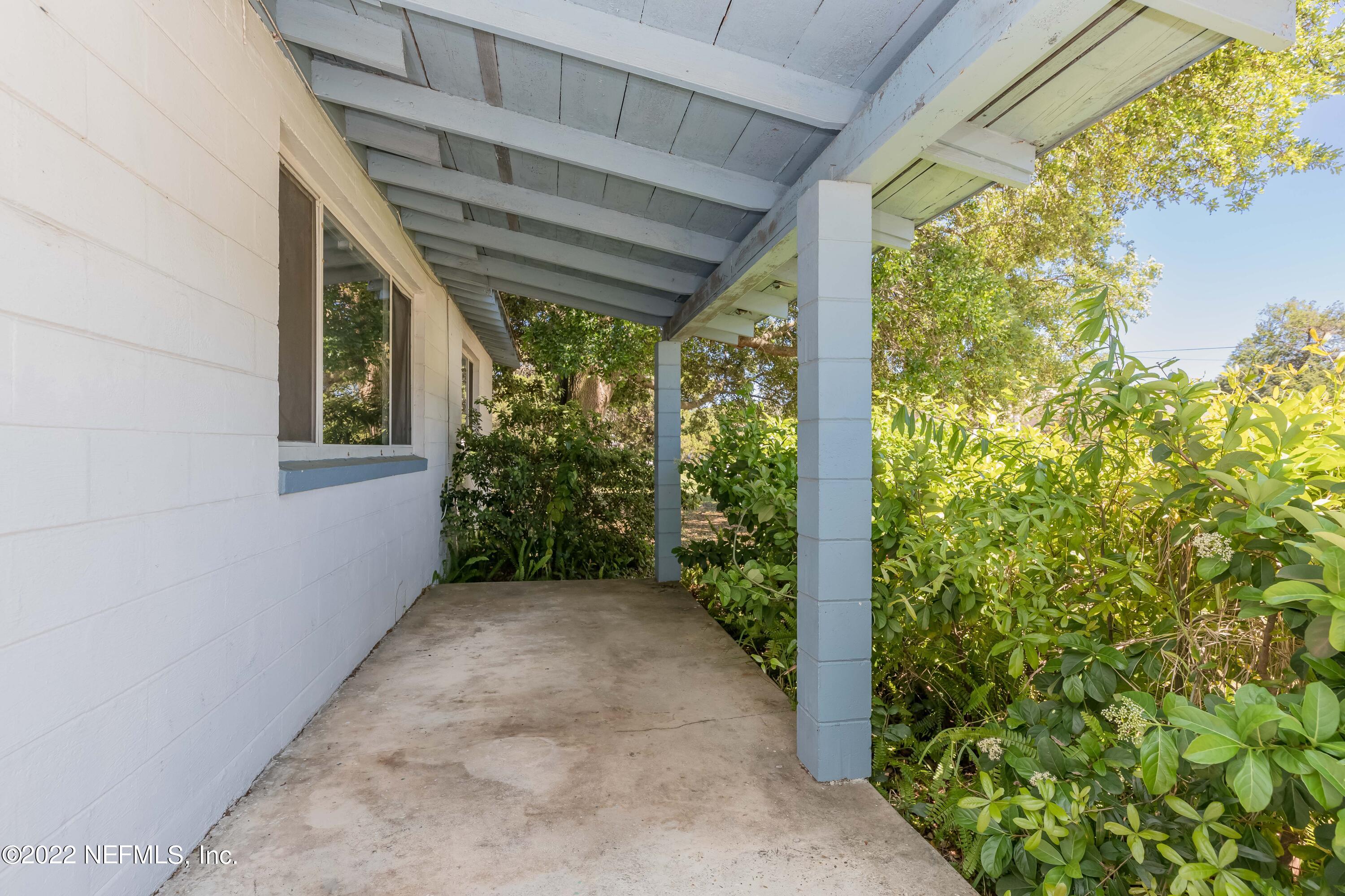 306 Ribault Street St. Augustine, FL 32080 - Photo 9 of 31 a view of a porch with wooden floor and roof