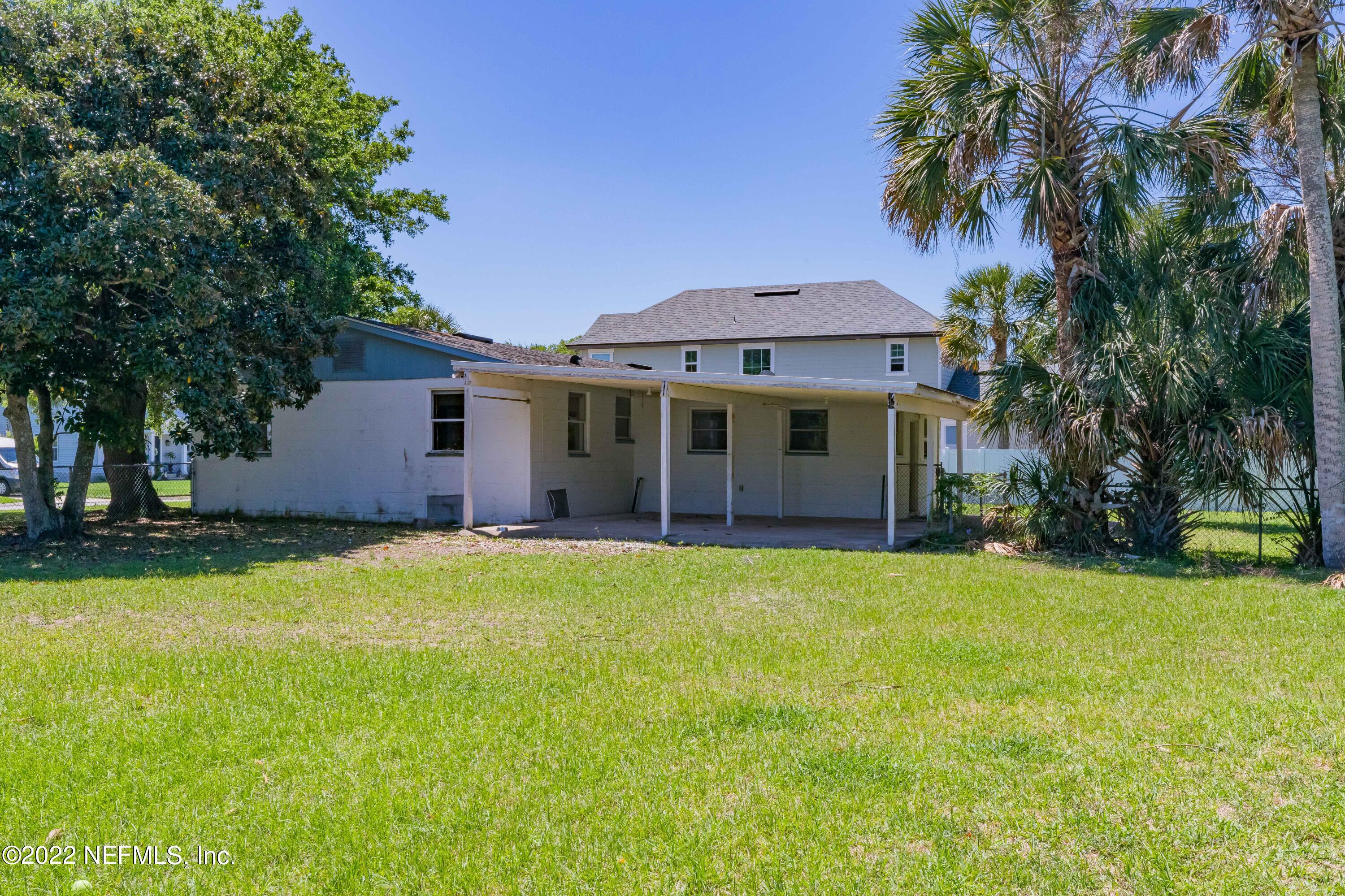 306 Ribault Street St. Augustine, FL 32080 - Photo 10 of 31 a view of a house with a yard and tree