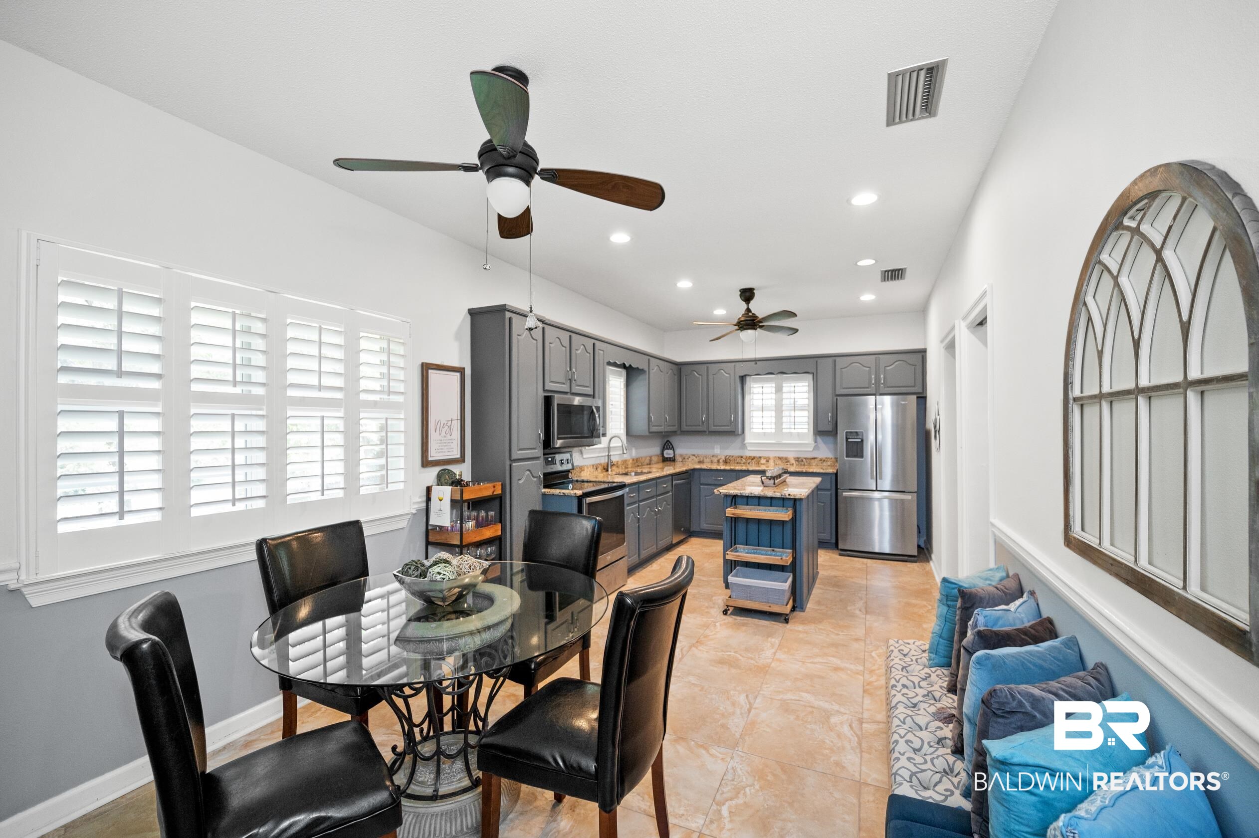 6638 Jackson Square Daphne, AL 36526 - Photo 3 of 62 Tiled dining area with sink and ceiling fan