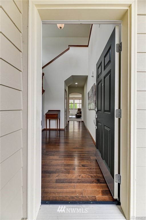 23007 42nd Drive Southeast Bothell, WA 98021 - Photo 2 of 29 a hallway with wooden floor table and chairs