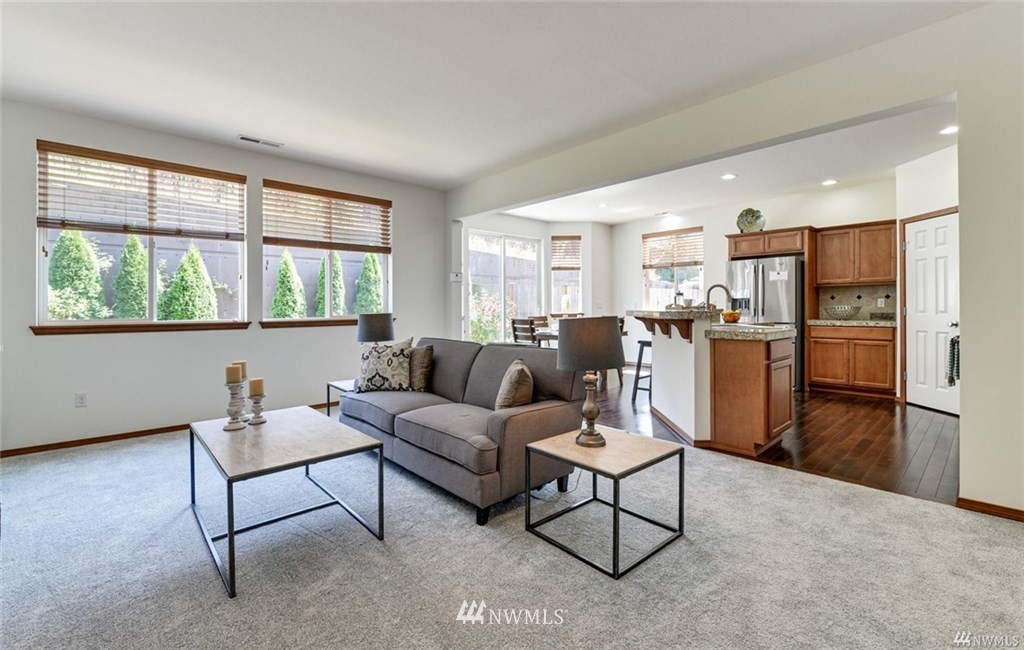 23007 42nd Drive Southeast Bothell, WA 98021 - Photo 11 of 29 a living room with furniture and a large window