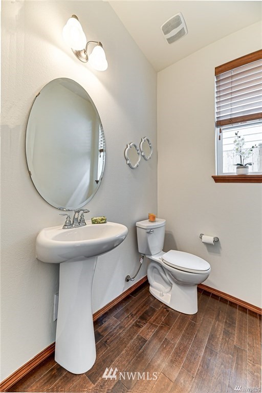 23007 42nd Drive Southeast Bothell, WA 98021 - Photo 12 of 29 a bathroom with a toilet a sink and a mirror