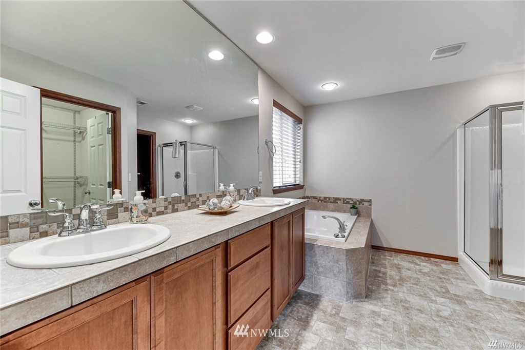 23007 42nd Drive Southeast Bothell, WA 98021 - Photo 15 of 29 a bathroom with a sink double vanity granite tub and shower