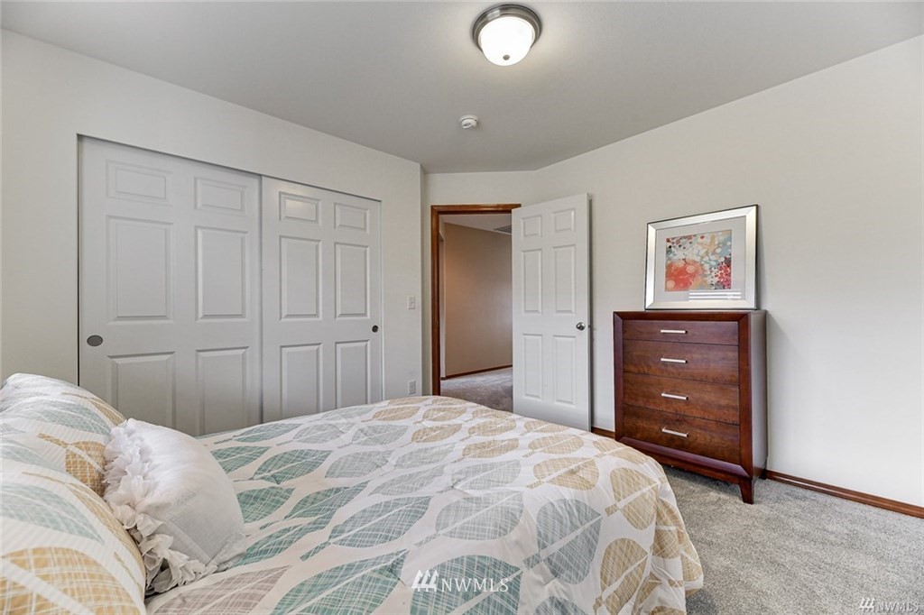 23007 42nd Drive Southeast Bothell, WA 98021 - Photo 19 of 29 a bedroom with a bed and a dresser