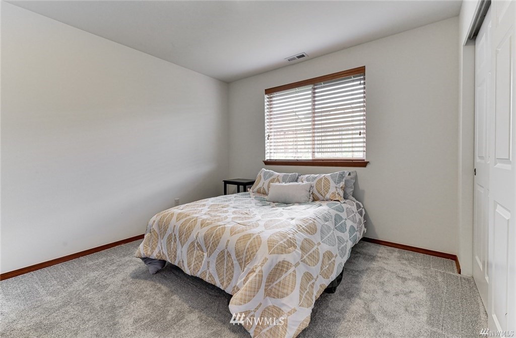 23007 42nd Drive Southeast Bothell, WA 98021 - Photo 20 of 29 a bedroom with a bed and next to a window