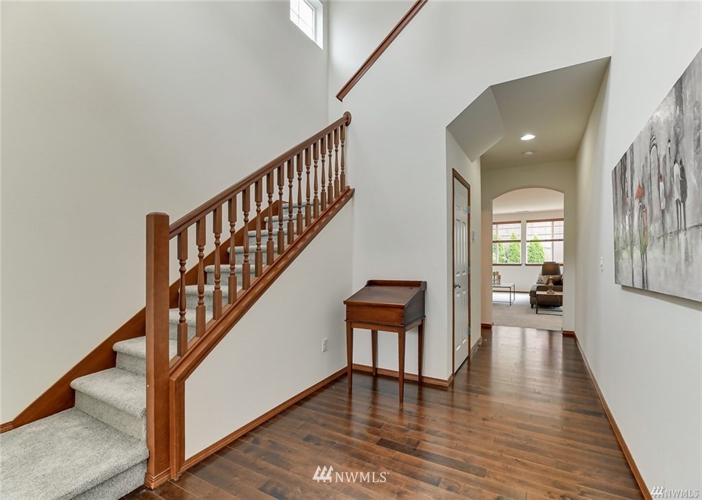 23007 42nd Drive Southeast Bothell, WA 98021 - Photo 3 of 29 a view of staircase with wooden floor and a rug