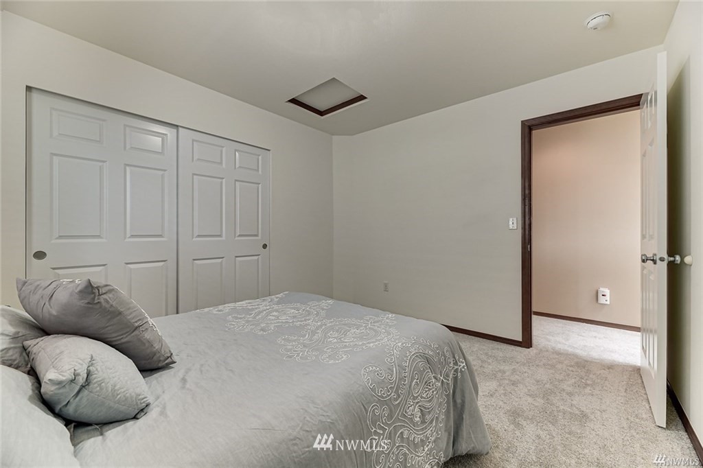 23007 42nd Drive Southeast Bothell, WA 98021 - Photo 22 of 29 a bedroom with a bed and a couch