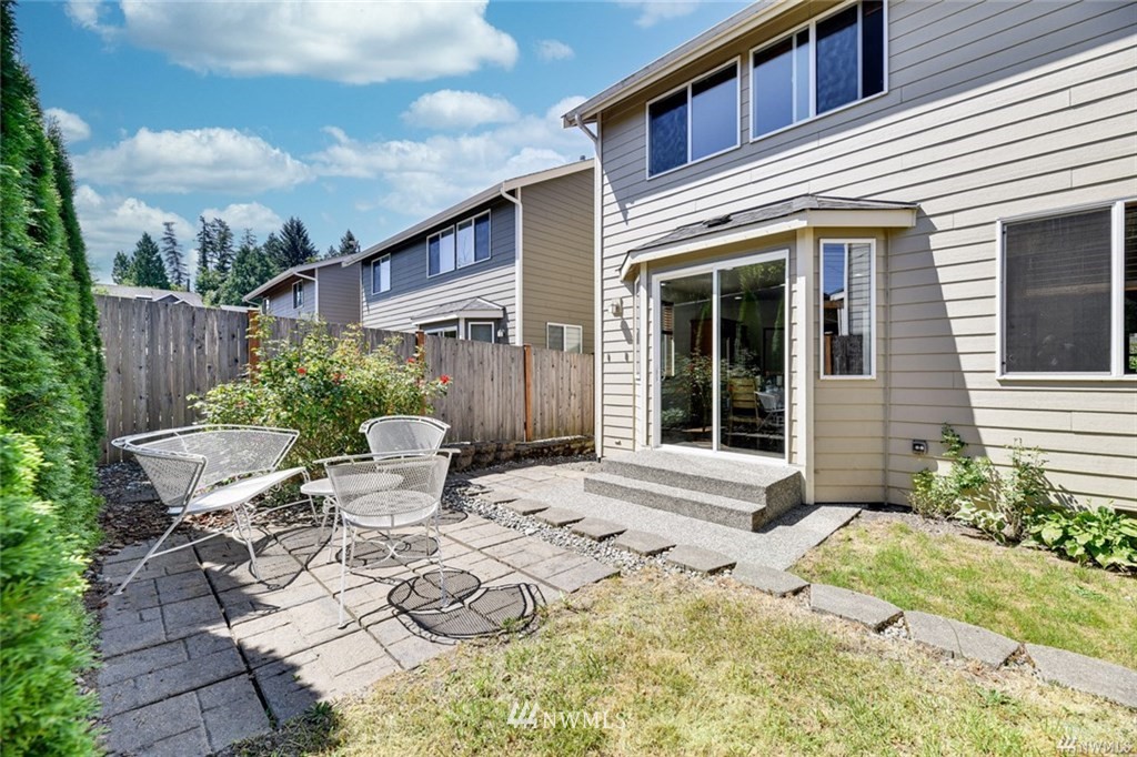 23007 42nd Drive Southeast Bothell, WA 98021 - Photo 28 of 29 a view of a chair and table in backyard of the house