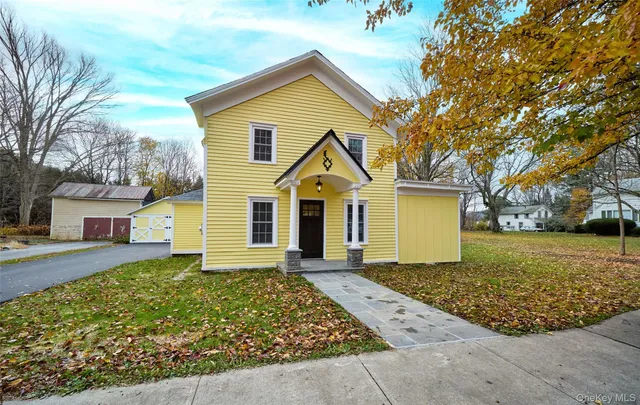 front view of a house with a yard