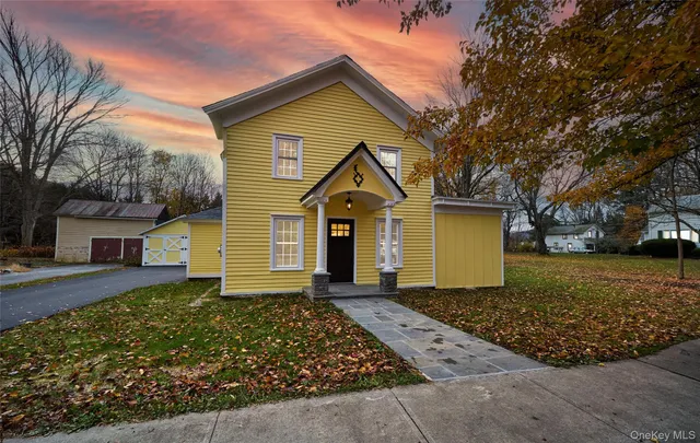 front view of a house with a yard