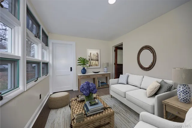 a living room with furniture and a rug
