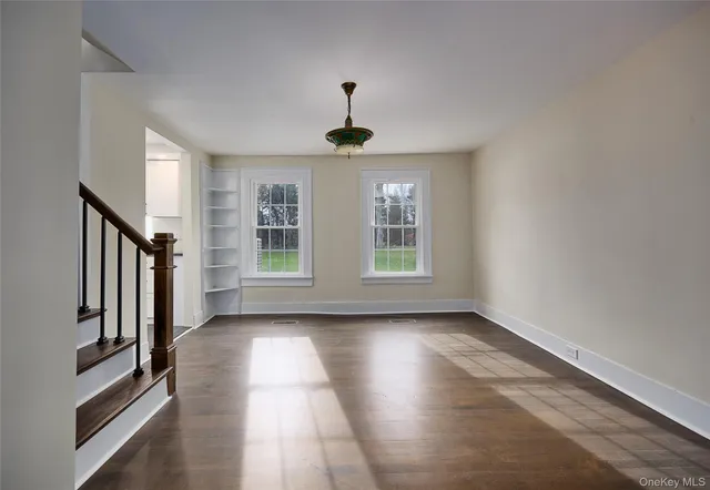 a view of a hallway with windows