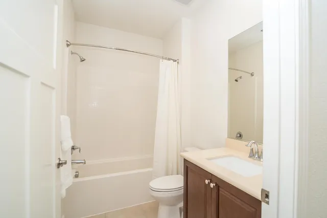 a bedroom with a bed and a desk