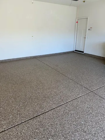 an aerial view of a house with table and chairs