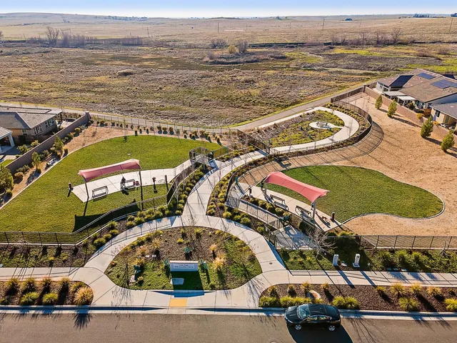 an aerial view of a house with swimming pool and outdoor space