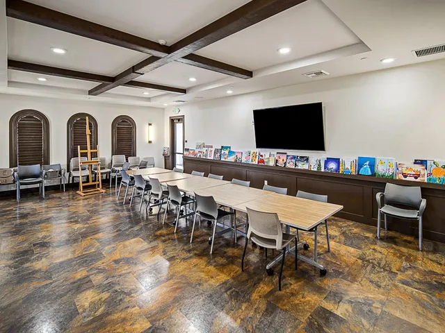 a living room with lots of furniture and a chandelier