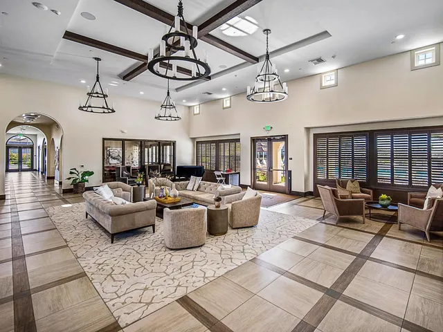 an aerial view of residential houses with outdoor space and swimming pool