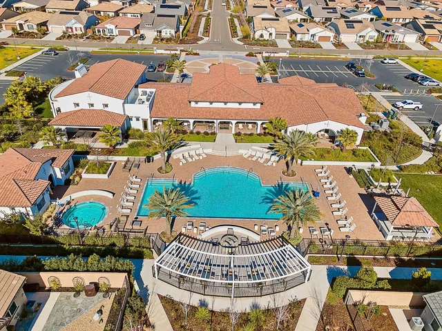 a room with pool table and windows