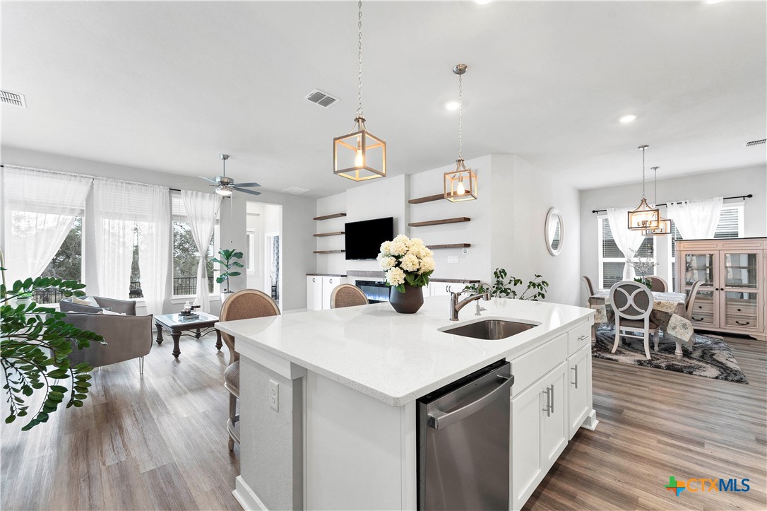 1616 Craftsman Road New Braunfels, TX 78132 - Photo 11 of 29 a view of kitchen with sink and living room